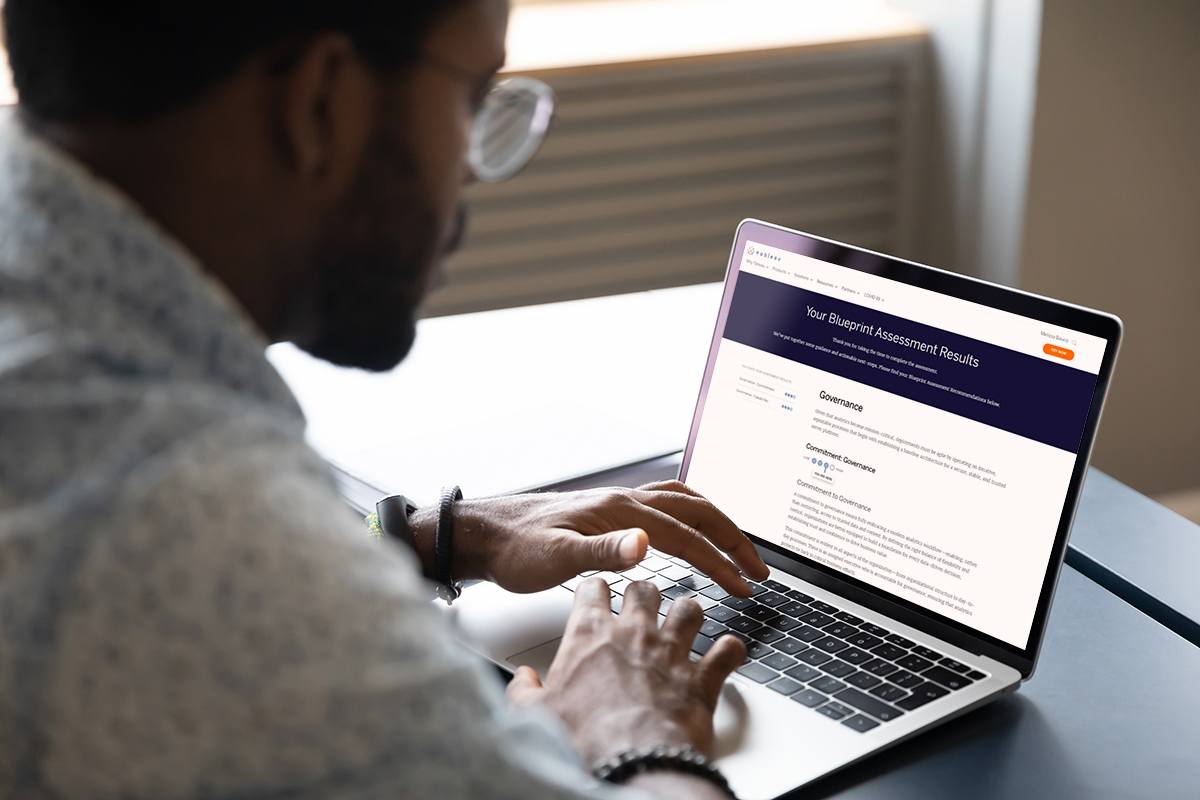Individuals reviewing their Tableau Blueprint Maturity Assessment results.