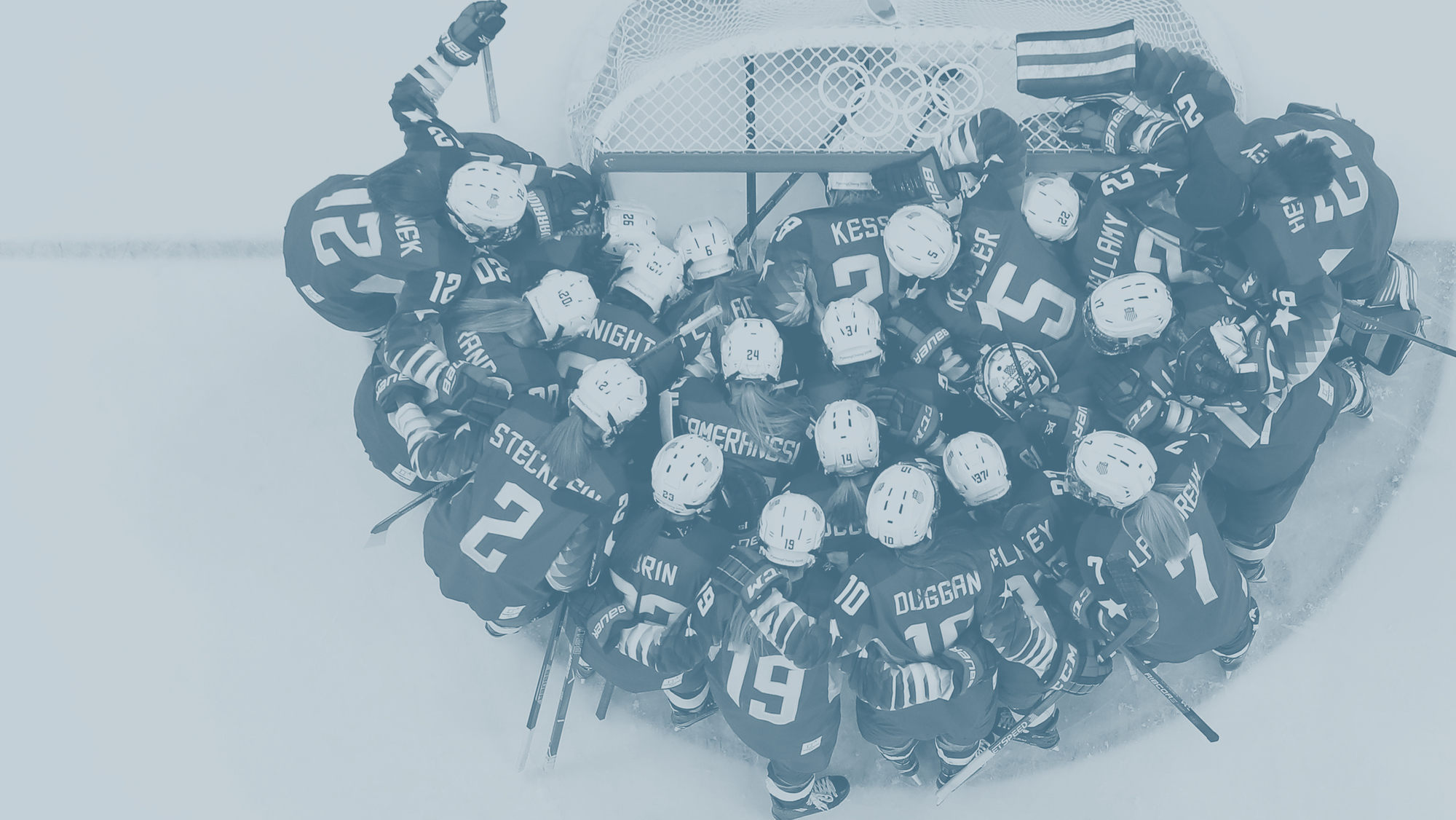 Team USA athletes gather on the ice.