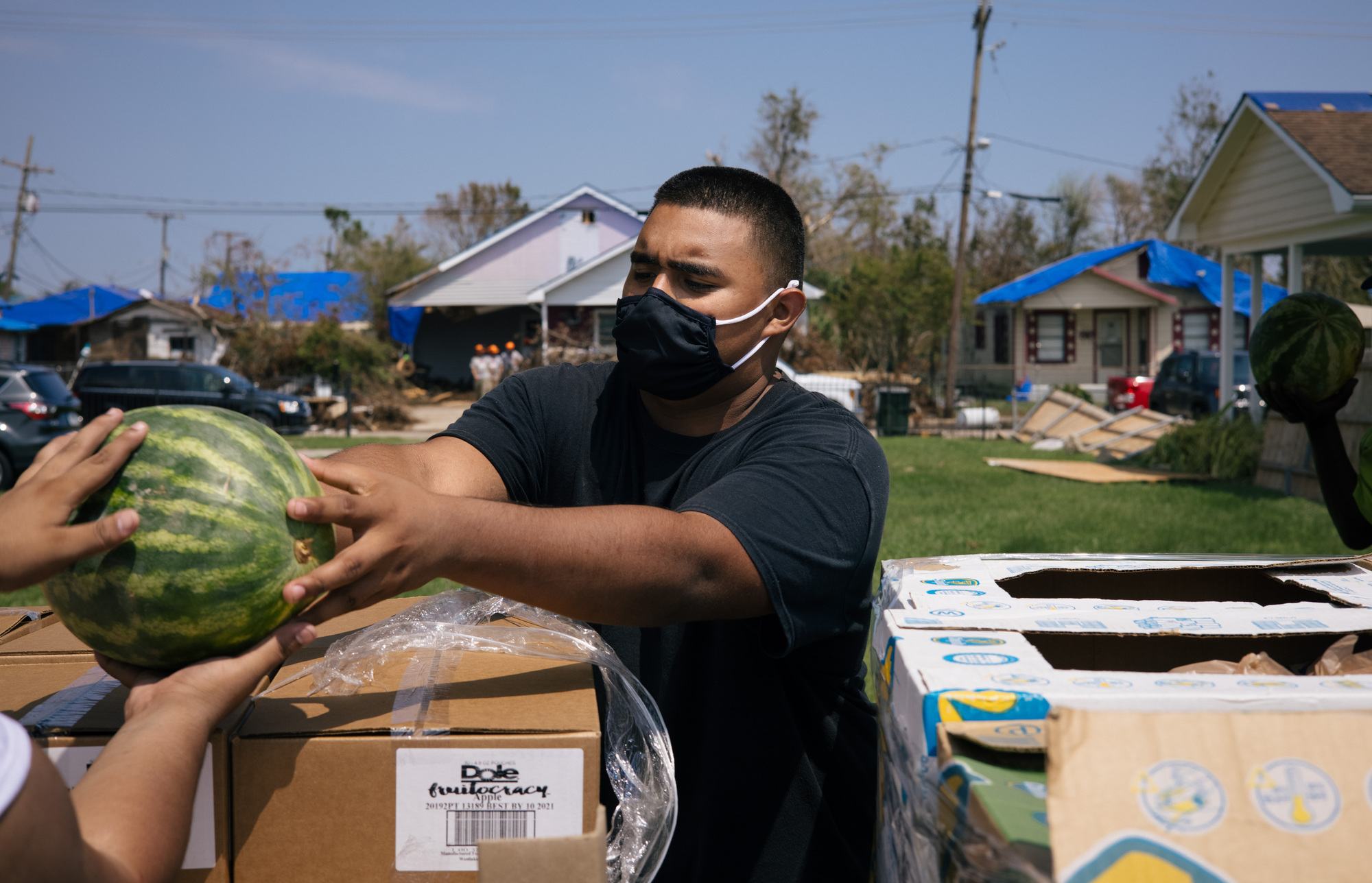 19-year-old Daniel helps out at a food pantry in Houma, L.A. after Hurricane Ida.