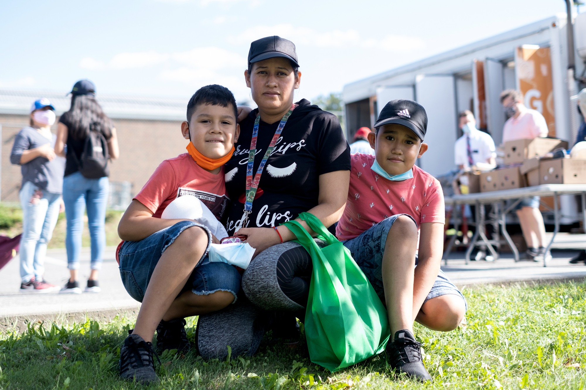 Beatriz Yarce and her sons, Alexis and Muriel, visiting the Feeding Westchester mobile pantry, in White Plains, N.Y.