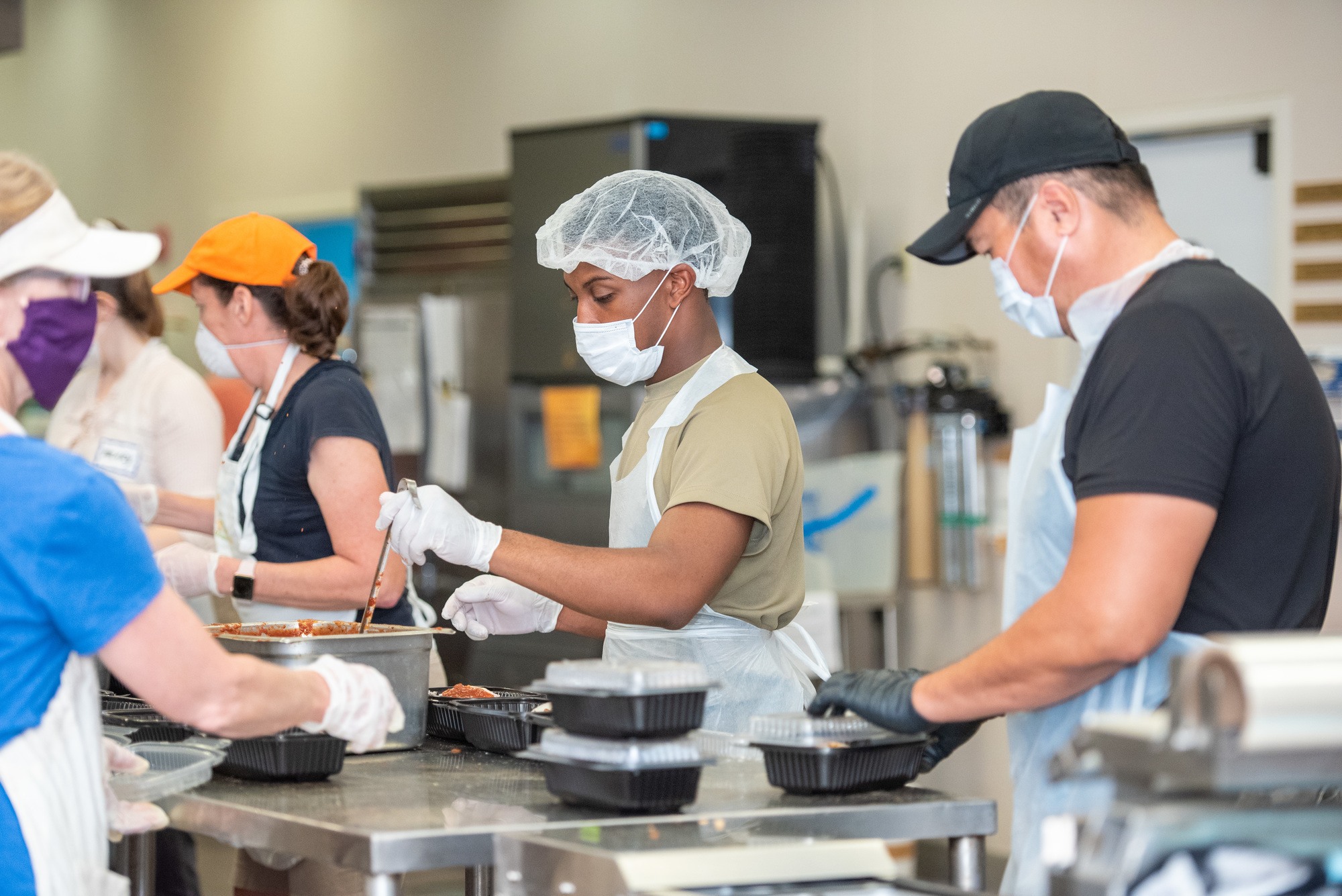 Second Harvest of Greater New Orleans & Acadiana volunteers prep food for their neighbors facing hunger during the COVID-19 crisis.