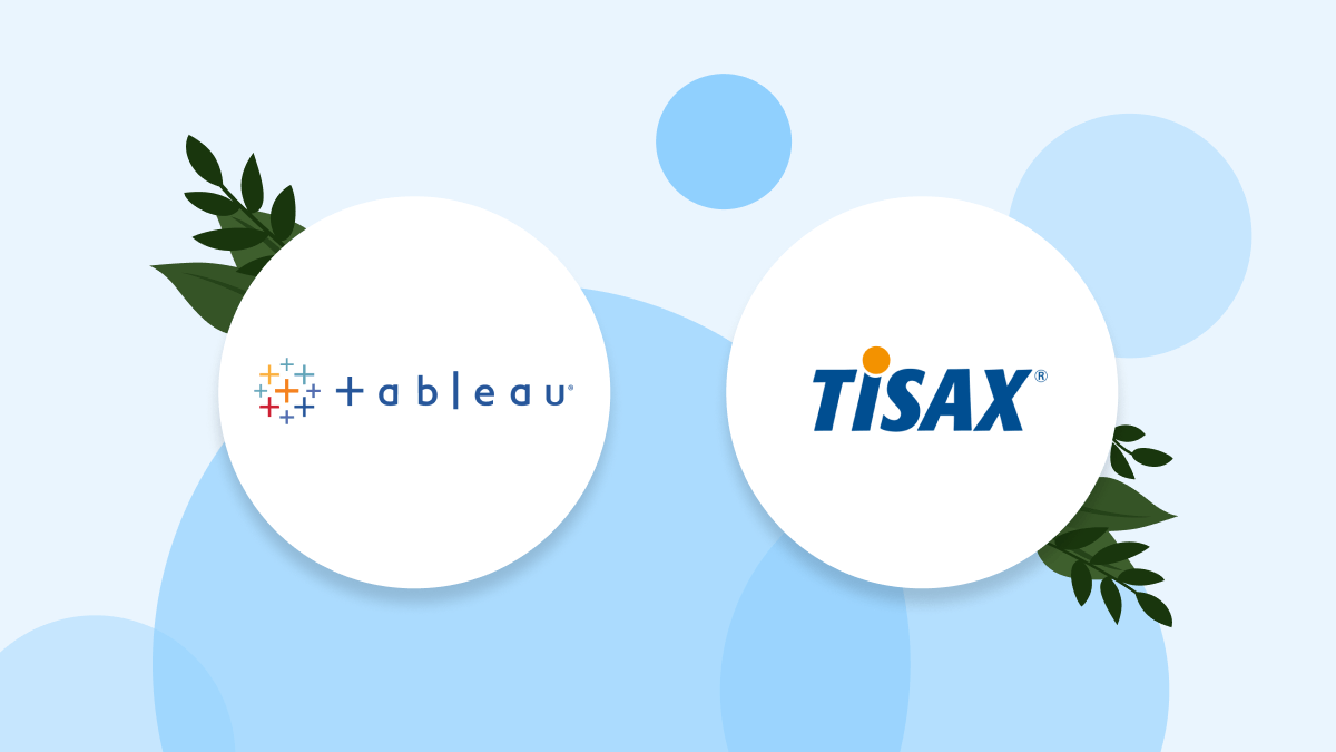 รูปภาพของโลโก้ Tableau และโลโก้ TISAX เคียงข้างกันในวงกลมสีขาวบนพื้นหลังสีน้ำเงินอ่อนโดยมีวงกลมสีน้ำเงินเข้มและใบไม้สีเขียวโปร่งใสเล็กน้อย