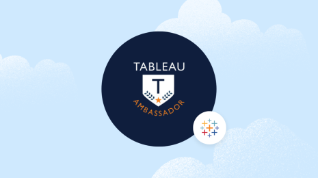 Tableau Ambassador logo in the center of a blue background with clouds